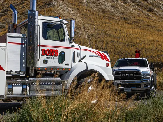 Cab of a Don's heavy wrecker with a Ram wrecker behind
