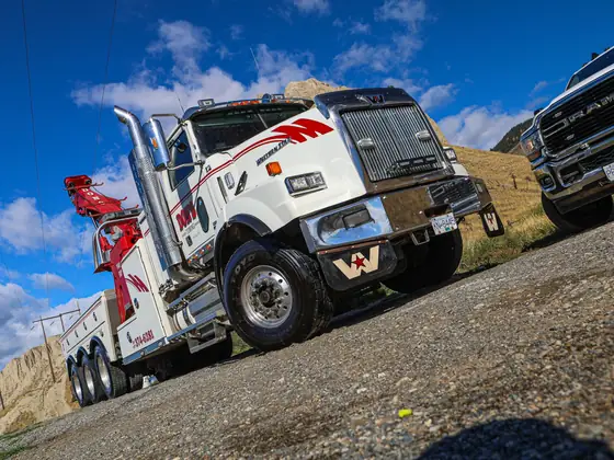 Angled shot of a Don's heavy wrecker with a Ram wrecker behind