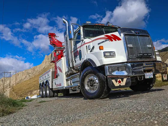 Don's heavy wrecker on a gravel road, front three-quarter view