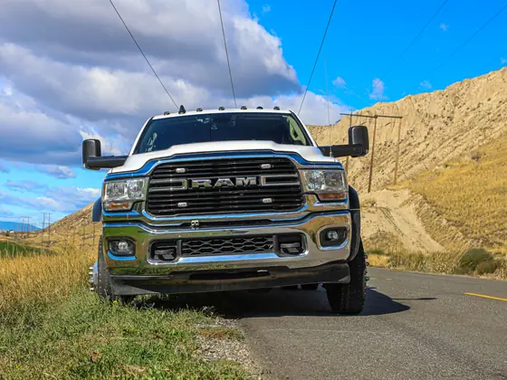 Front view of a Don's Ram truck on a country road