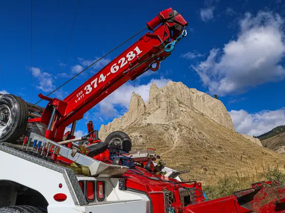Don's Ram wrecker's red boom with the phone number, seen from below