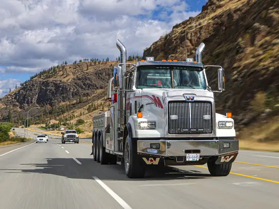 Don's heavy wrecker driving down a highway