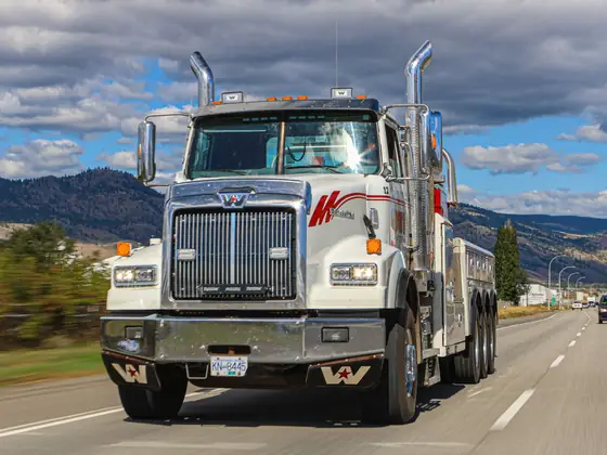 Head-on view of a Don's heavy wrecker on the highway