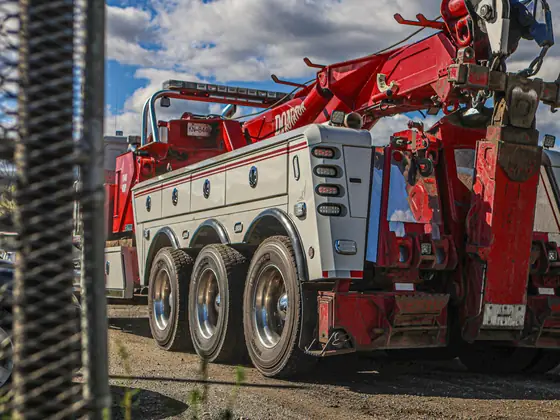 Rear of a Don's heavy wrecker seen through a chain-link fence