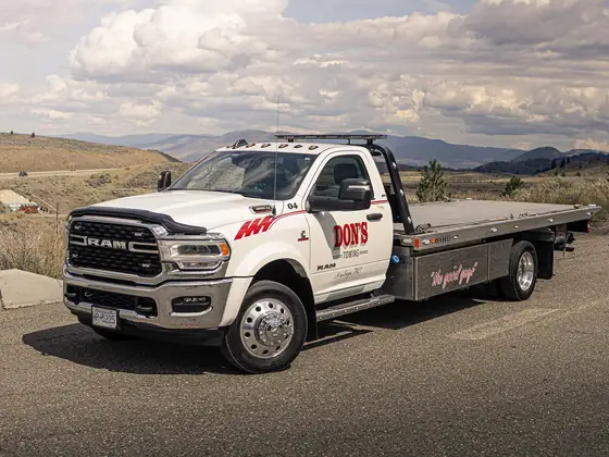 Don's Ram flatbed tow truck, front three-quarter view